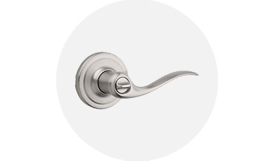 Kwikset Tustin Collection Lever product isolated on top of a gray circle